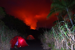VANUATU - AMBRYM - BENBOW Base camp of the VANUATU Expedition on Ambrym island with VOLCANODISCOVERY.
The reflection of the incandescence of the lava lake forms a red glow in the gas plume of the BENBOW volcano, located inside the Caldera of Ambrym.
© Yashmin CHEBLI